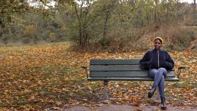 woman sitting on park bench