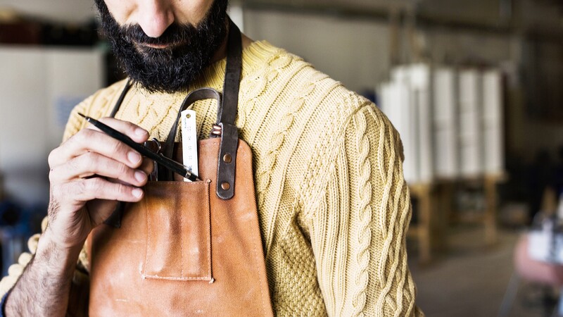 Man with brown apron
